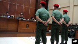 Indonesian special forces soldiers listen as judges deliver their sentence at a military court in Yogyakarta, Indonesia, Sept. 5, 2013.