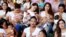 FILE - Mothers nurse their children to mark the World Breastfeeding Week to promote global support for breastfeeding in Ciudad Juarez, Mexico, Aug. 4, 2018.