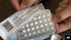 FILE - A one-month dosage of hormonal birth control pills is displayed in Sacramento, California, Aug. 26, 2016.