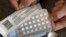 FILE - A one-month dosage of hormonal birth control pills is displayed in Sacramento, California, Aug. 26, 2016.