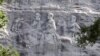 FILE - A carving in stone depicting Confederate Civil War figures Stonewall Jackson, Robert E. Lee and Jefferson Davis, in Stone Mountain, Georgia, June 23, 2015. The sculpture is America's largest Confederate memorial. 