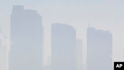 Smoke haze covers Sydney, Nov. 19, 2019, as wildfires burn near the city.