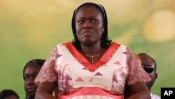 FILE - In this Jan. 15, 2011 file photo Simone Gbagbo attends a rally in support of her husband, former President Laurent Gbagbo, in Abidjan, Ivory Coast.