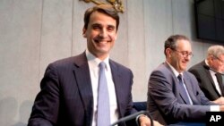 FILE - New president of the Institute of Religious Works, or IOR (Vatican bank), Jean-Baptiste de Franssu, left, July 9, 2014. 