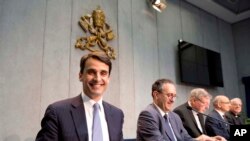 FILE - New president of the Institute of Religious Works, or IOR (Vatican bank), Jean-Baptiste de Franssu, left, July 9, 2014. 