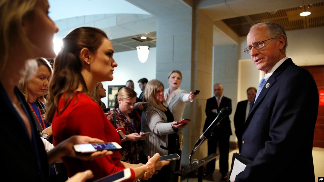 FILE - Rep. Mike Conaway, R-Texas, right, who leads the House Intelligence Committee's Russia investigation, speaks to the media on Capitol Hill in Washington, Feb. 15, 2018.