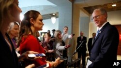 FILE - Rep. Mike Conaway, R-Texas, right, who leads the House Intelligence Committee's Russia investigation, speaks to the media on Capitol Hill in Washington, Feb. 15, 2018.