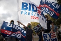 Biden supporters gather outside of a campaign event held by U.S. Democratic presidential candidate Joe Biden in Cincinnati, Ohio, Oct. 12, 2020.