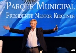 FILE - Argentine presidential candidate Alberto Fernandez acknowledges the audience during a campaign rally in Buenos Aires, Argentina, May 25, 2019.