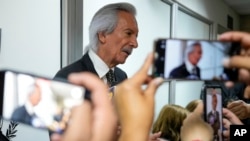 FILE - Guatemalan journalist Jose Ruben Zamora, founder of El Periodico newspaper, talks with reporters in Guatemala City, Oct. 18, 2024.