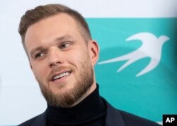 FILE - Gabrielius Landsbergis speaks to the media in Vilnius, Lithuania, Oct. 11, 2020.