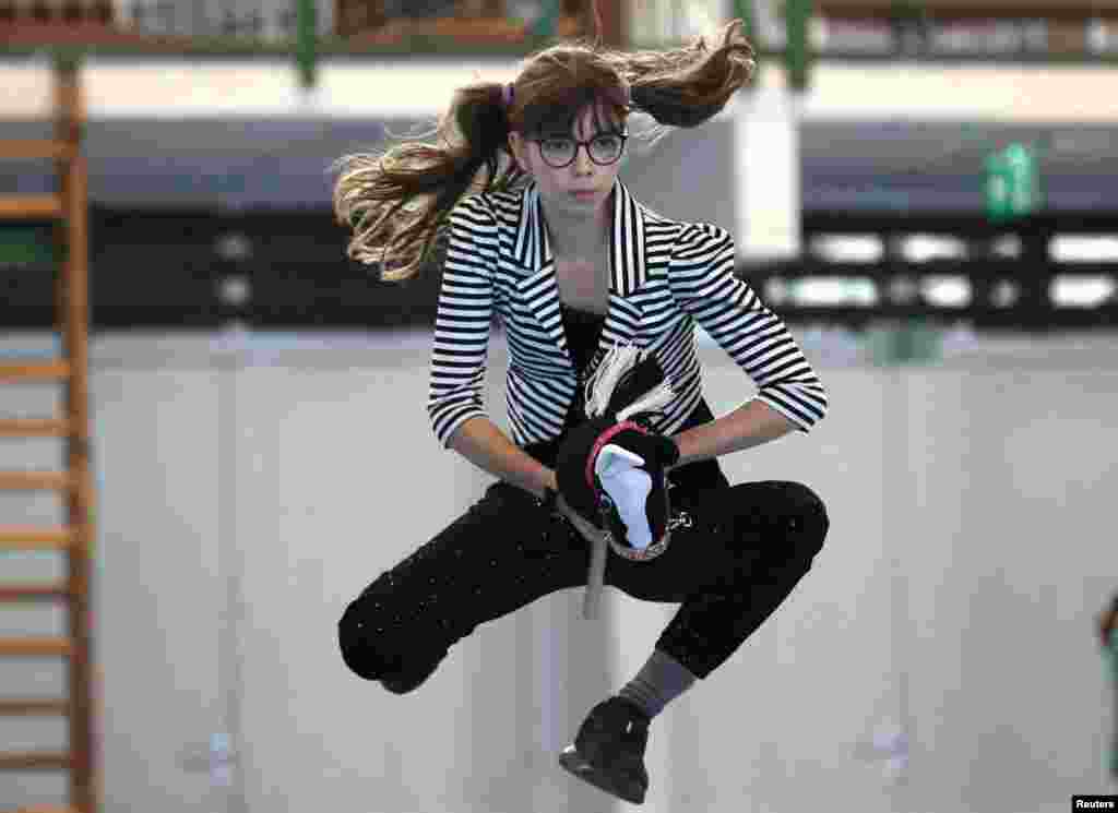 A woman competes during the Hortobagy Hobby Horse Cup in Tiszafured, Hungary.