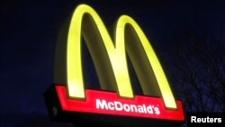 FILE - A sign is seen at a McDonald's restaurant in Queens, N.Y., March 17, 2020. 