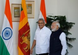 Indian Prime Minister Narendra Modi, right, walks with Sri Lankan President Gotabaya Rajapaksa before their delegation level talks in New Delhi, India, Nov. 29, 2019.