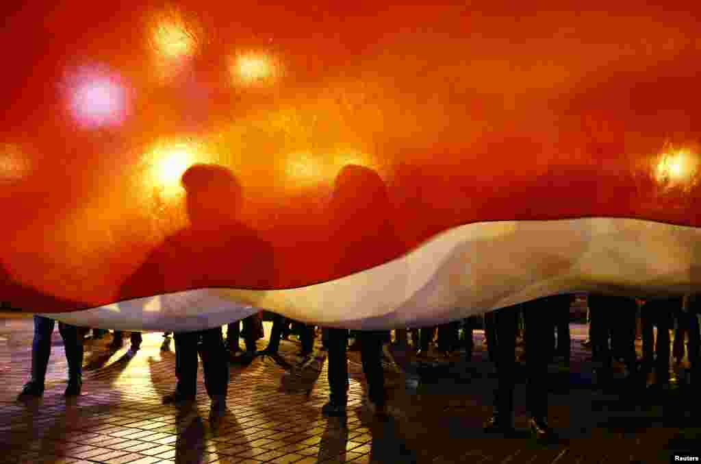 People take part in a rally to protest against the upcoming Zapad-2017 war games, held by Russian and Belarussian servicemen, and to mark the Day of Belarussian Military Glory in Minsk, Belarus.