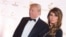 FILE - Donald Trump and Melania Trump attend a benefit at Trump Tower in New York, Nov. 19, 2014.
