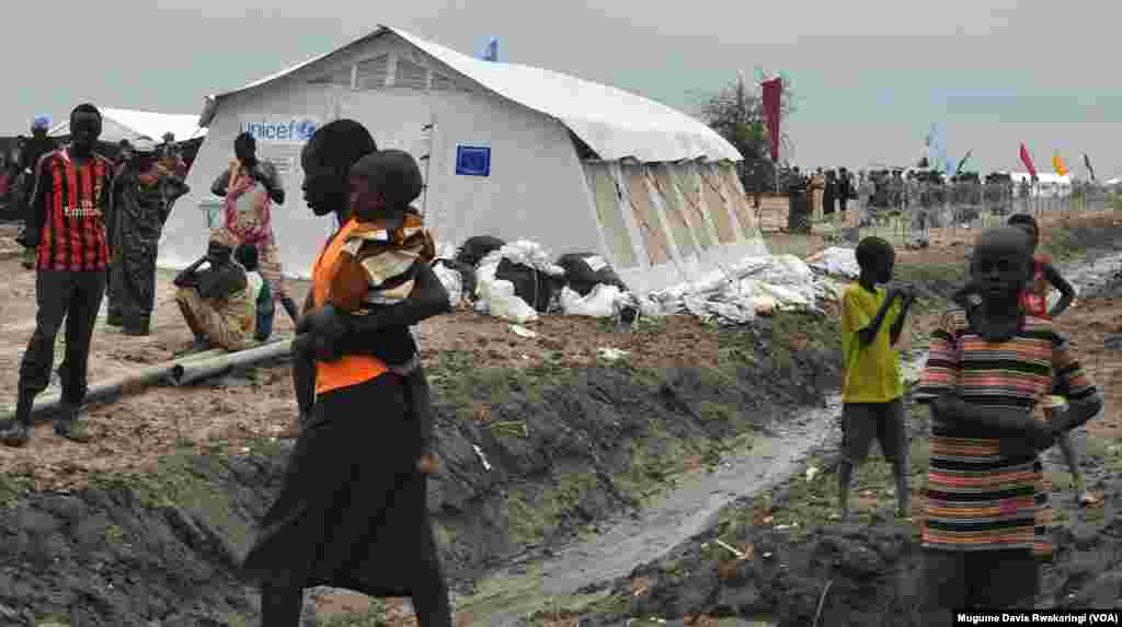 Children living at the UNMISS compound in Malakal hang around near a UNICEF tent. There are no schools at the UNMISS base, and the schools in town are shut.