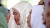 A woman weeps during a prayer marking 20 years of the massive Indian Ocean tsunami, in Banda Aceh, Indonesia, Dec. 26, 2024.