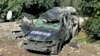 FILE - A destroyed car marked "Press" is seen at the site of an Israeli airstrike that targeted an area where a number of journalists were located in the southern Lebanese village of Hasbaya on Oct. 25, 2024.