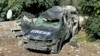 A destroyed car marked "Press" is seen at the site of an Israeli airstrike that targeted an area where a number of journalists were located in the southern Lebanese village of Hasbaya on Oct. 25, 2024.