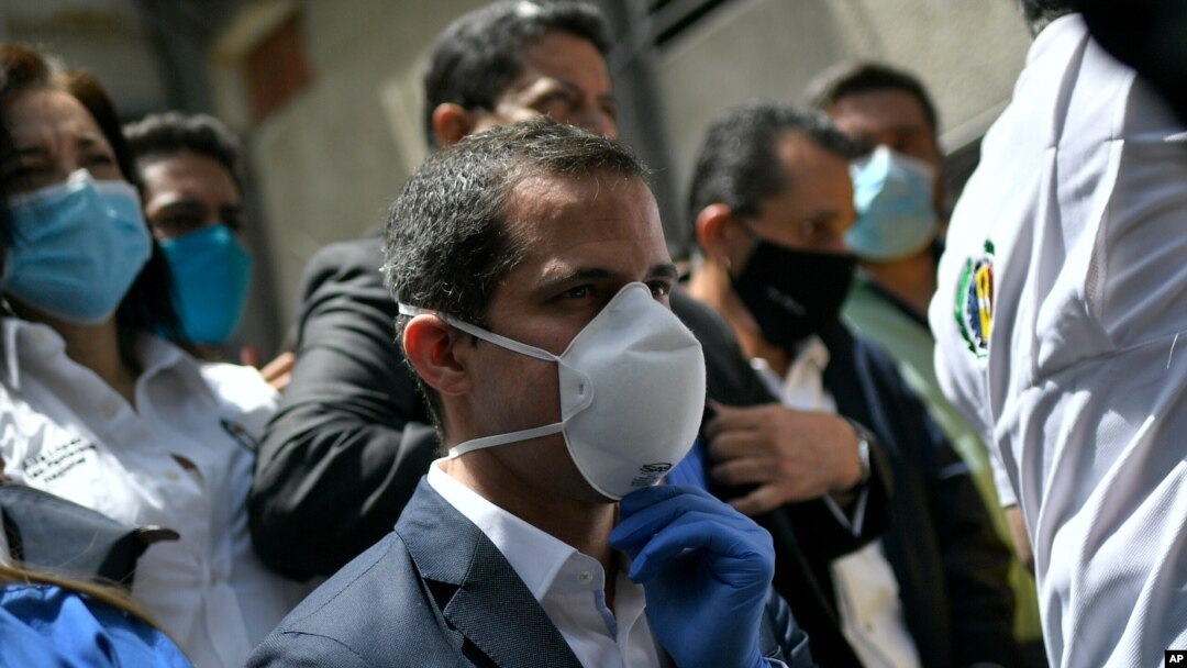 FILE - Venezuelan opposition leader Juan Guaido arrives at the headquarters of the Democratic Action political party, in Caracas, Venezuela, June 17, 2020.