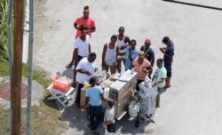 An aerial view shows people lining up for food after Hurricane Dorian hit the Grand Bahama Island, in the Bahamas, Sept. 4, 2019.