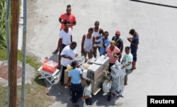 An aerial view shows people lining up for food after Hurricane Dorian hit the Grand Bahama Island, in the Bahamas, Sept. 4, 2019.