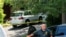 A law enforcement official is seen outside the home of federal judge Esther Salas, where her son was shot and killed and her defense attorney husband was critically injured, in North Brunswick, New Jersey, July 20, 2020.