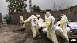 Members of the Congolese Red Cross gather the bodies of victims from the recent clashes at the morgue of the Provincial Hospital of North Kivu in Goma on Jan. 29, 2025.