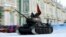 FILE - A Soviet WWII-era T-34 tank rolls on Dvortsovaya Square during the general rehearsal of Jan. 27 military parade marking the 75th anniversary of the lifting of the Nazi siege of Leningrad, in Saint Petersburg, Jan 24, 2019.