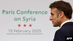 France's President Emmanuel Macron looks on at the end of the International Conference on Syria at the Ministerial Conference Center in Paris, Feb. 13, 2025.