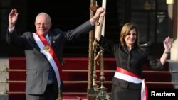 Peru's President Pedro Pablo Kuczynski and new Prime Minister Mercedes Araoz gesture during her swearing-in ceremony at the government palace in Lima, Peru, Sept. 17, 2017.