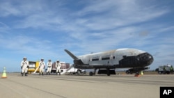 This undated photo provided by the U.S. Air Force shows an X-37B Orbital Test Vehicle at NASA's Kennedy Space Center in Florida. An unmanned Falcon rocket that carried one of these experimental planes blasted off Thursday, Sept. 7, 2017, from Florida's Kennedy Space Center.