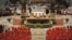 In this photo provided by the Vatican newspaper <em>L'Osservatore Romano</em>, Pope Francis, top center, leads a consistory inside the St. Peter's Basilica at the Vatican. Retired Pope Benedict XVI joined Pope Francis at a ceremony creating the cardinals who will elect their successor in an unprecedented blending of papacies past, present and future.