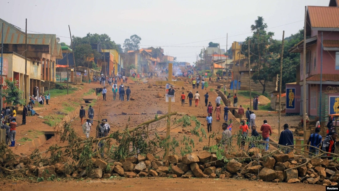 FILE - Demonstrators barricade a road during protests over their exclusion from the presidential election in Beni, Democratic Republic of Congo, Dec. 28, 2018. 
