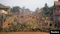 FILE - Demonstrators barricade a road during protests over their exclusion from the presidential election in Beni, Democratic Republic of Congo, Dec. 28, 2018. 