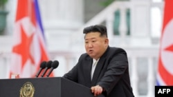 This picture taken on September 9, 2024 and released by North Korea's official Korean Central News Agency (KCNA) via KNS on September 10, 2024 shows North Korean leader Kim Jong Un delivering a speech on the 76th anniversary of the founding of the DPRK, a