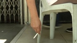 Smokers caught lighting up at an eatery face fines ranging from the equivalent of $35 to $85 USD. (Dave Grunebaum/VOA)