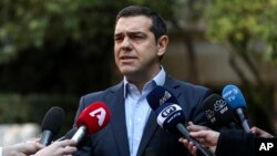 Greece's Prime Minister Alexis Tsipras makes a statement following the resignation of Defense Minister Panos Kammenos, in Athens, Jan. 13, 2019.