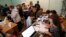 People, who have fled the fighting in the eastern regions of Ukraine, queue for job vacancies at an employment fair at the dormitories where they have taken refuge in Krasnoyarsk Russia, Sept. 2, 2014. 