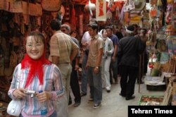 Chinese tourists visit an Iranian bazaar in this undated photo published by the Tehran Times newspaper in November 2019 (Credit: Tehran Times)