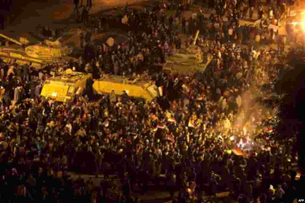 Anti-government protesters celebrate in Tahrir Square in downtown Cairo, Egypt Thursday, Feb. 10, 2011. Egypt's military announced on national television it had stepped in to secure the country and promised protesters calling for President Hosni Mubarak's