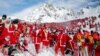 People dressed as Santa Claus enjoy the snow during the Saint Nicholas Day at the Alpine ski resort of Verbier, Switzerland, December 2, 2017. 