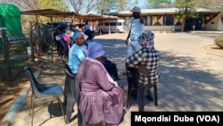 FILE - Women queue to vote at a polling station in Kumakwane, Botswana, on Oct. 30, 2024. Authorities said on Jan. 14, 2025, that over a two-week period in December and January, 93 cases of rape and 10 murders of women were reported in Botswana.