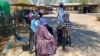 Some women queue to vote at a polling station in Kumakwane, Botswana, on Oct. 30, 2024.