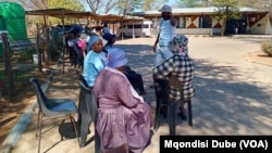 Some women queue to vote at a polling station in Kumakwane, Botswana, on Oct. 30, 2024.