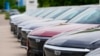 FILE - Unsold 2024 electric Lyriq utility vehicles sit outside a Cadillac dealership on June 2, 2024, in Lone Tree, Colo.