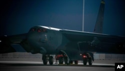 In this photo released by the U.S. Air Force, a B-52 bomber parks on the tarmac at Al-Udeid Air Base in Qatar on April 23, 2021. The U.S. Air Force has positioned two B-52 bombers in Qatar to support the American withdrawal from Afghanistan.