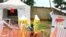 FILE - Health workers walk with a boy suspected of having been infected with the Ebola virus, at an Ebola treatment center in Beni, near Congo's border with Uganda, Sept. 9, 2018.