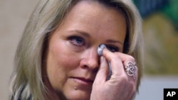 Former Boston television news anchor Heather Unruh wipes tears while speaking Nov. 8, 2017, in Boston about the alleged sexual assault of her teenage son by actor Kevin Spacey in the summer of 2016 on Nantucket.